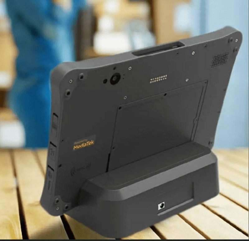 Tablet device on a charging dock. Tablet device on a charging dock.