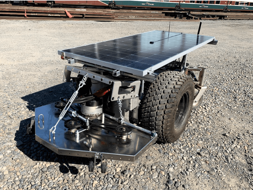 Solar-powered robotic vehicle on gravel.