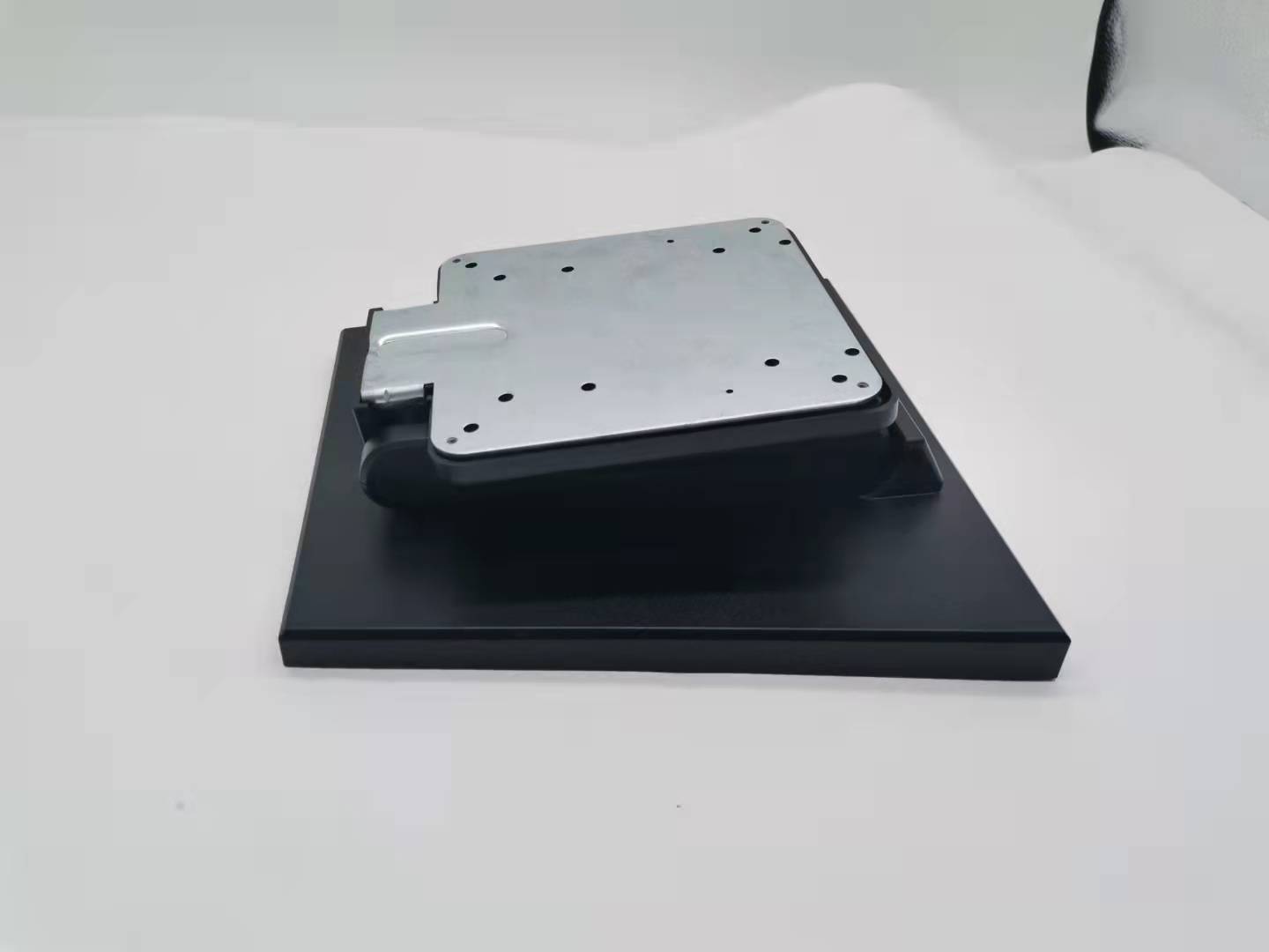 Metallic component on a black platform. Metallic component on a black platform.